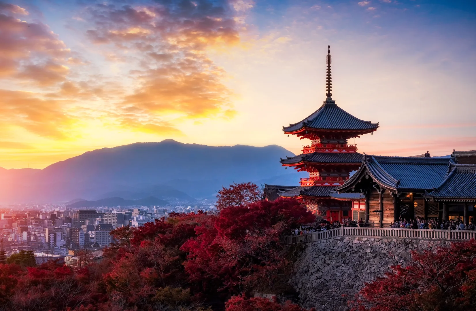 Beautiful Japanese temple at sunset with autumn colors